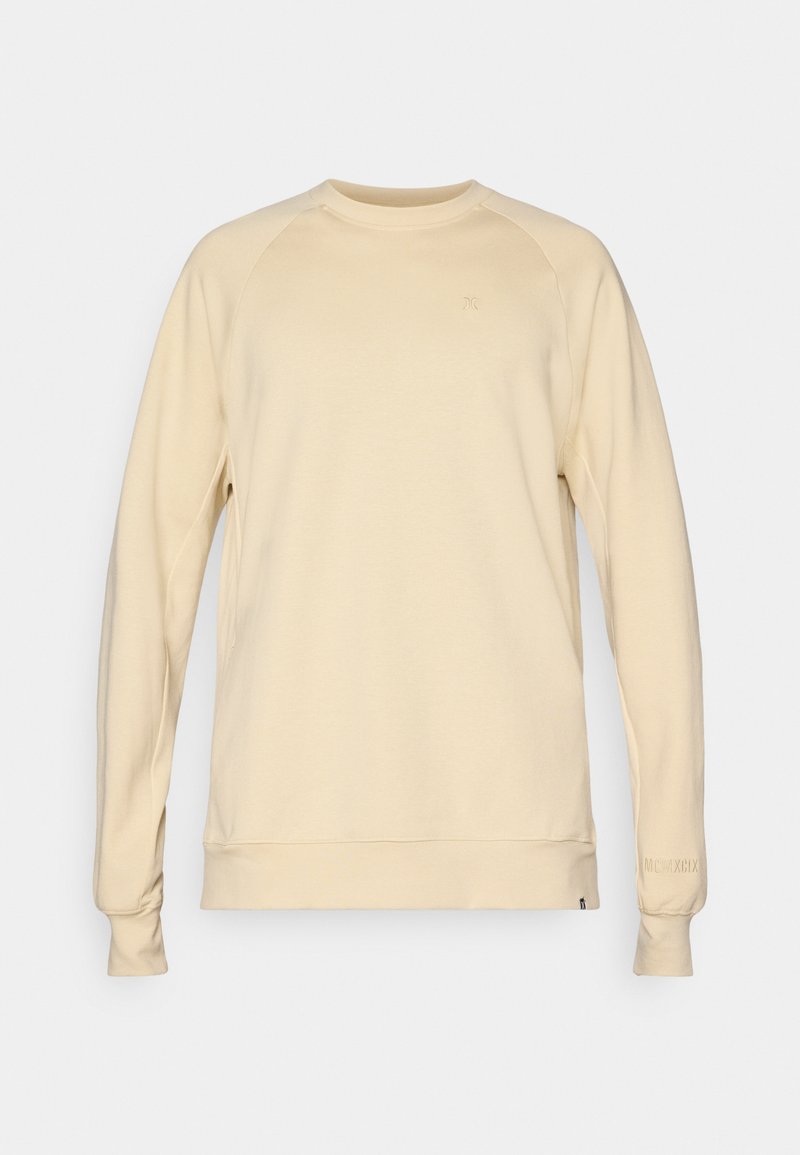 Helle beige Sweatshirt mit langen Ärmeln, Rundhalsausschnitt und gerippten Bündchen. Es verfügt über ein dezentes Logo auf der Brust und einen Textdetails an den Ärmeln.