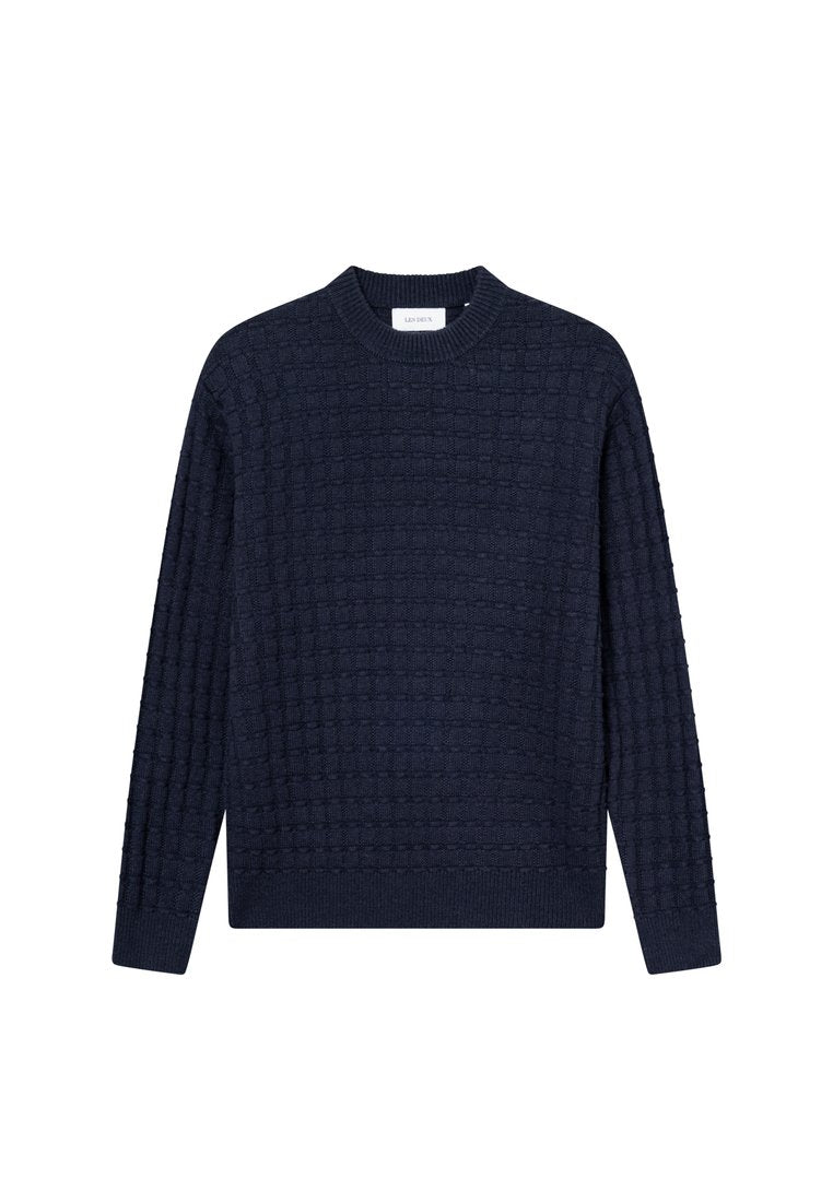 Marineblauer Strickpullover aus strukturiertem Material, mit Rundhalsausschnitt und langen Ärmeln im Karomuster.