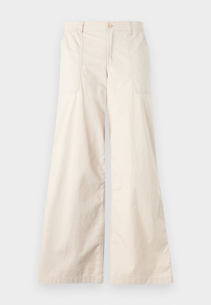Beige weite Hosen mit Knopfverschluss, elastischem Bund und zwei seitlichen Taschen. Glattes Baumwollgewebe mit weicher Textur.