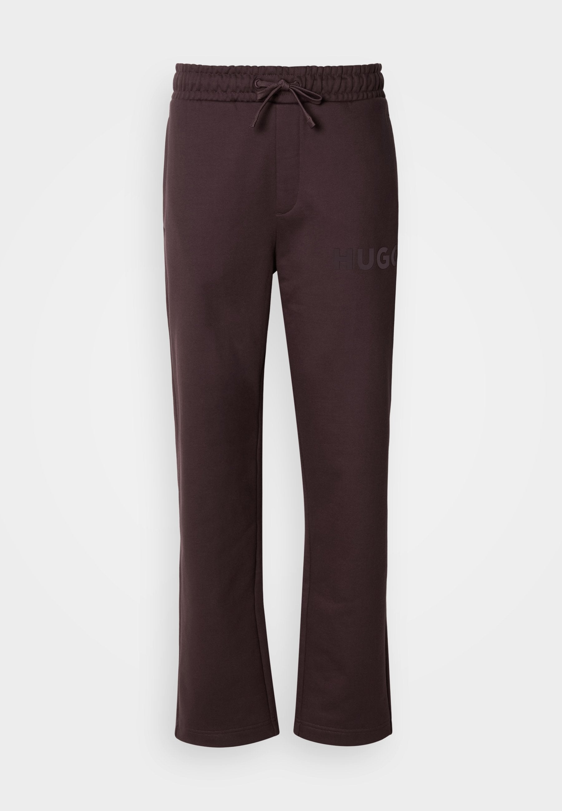 Dunkelbraune Jogginghose mit elastischem Bund, Kordelzug, seitlichen Taschen und dem auf dem linken Bein aufgedruckten "HUGO"-Logo. Weiche Textur.