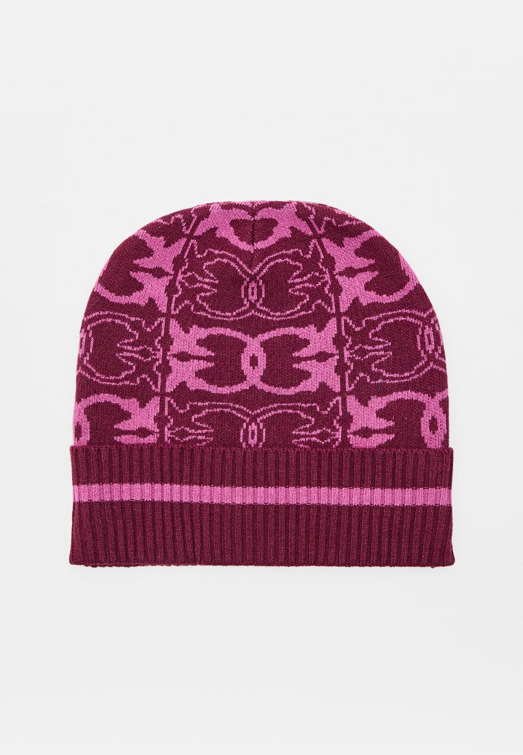 Gestrickte Mütze mit symmetrischem Blumenmuster in Dunkelrosa und Magenta sowie einem gerippten, umgeschlagenen Bündchen mit einem einzelnen, helleren rosa Streifen.