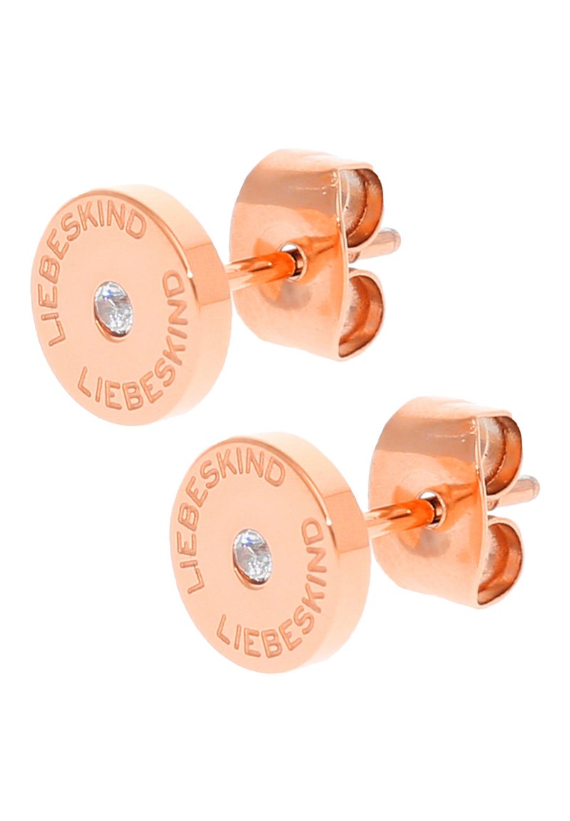 Ohrstecker aus roségoldfarbenem Metall mit einem kreisförmigen Design, versehen mit einem zentralen klaren Stein und dem eingravierten Markennamen "LIEBESKIND." Sicherer Steckverschluss.