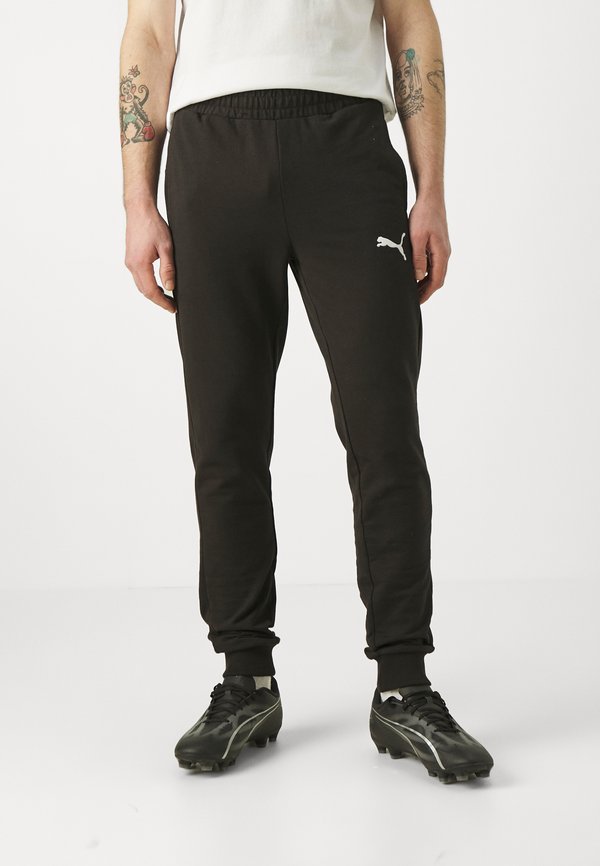 Puma TEAMGOAL CASUALS PANTS - Tracksuit bottoms - black/white