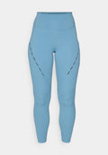 Hochtaillierte, hellblaue Leggings aus elastischem Stoff. Mit dekorativen Ausschnitten an den Seiten und eng anliegenden Knöchellöchern.