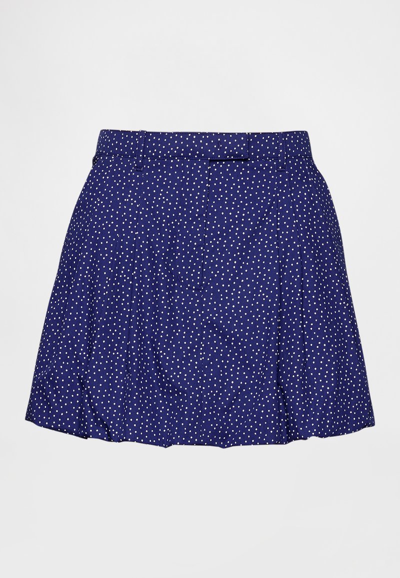 Marineblauer Rock mit weißen Punkten, ausgestattet mit einem Taillenbund und einem plissierten Design für eine ausgestellte Form. Hergestellt aus leichtem Stoff.