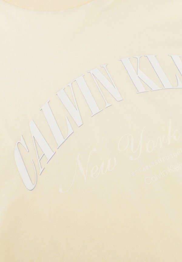Calvin Klein CALVIN KLEIN DAMES TOPS SS CROPPED BOXY HERITAGE CREST.