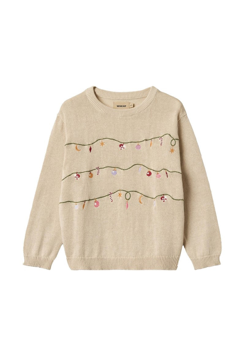 Beiger gestrickter Pullover mit gestickten dekorativen Elementen, die festliche Lichter und Ornamente auf einem grünen gestickten Linienmuster darstellen.