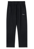 Schwarze gerippte Lounge-Hosen mit elastischem Bund, zwei Reißverschlusstaschen und einem weißen, gestickten Logo an der Seite.