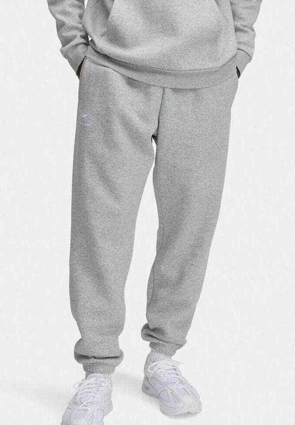 Under Armour ICON FLEECE - Tracksuit bottoms - grau