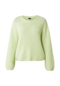 Limettengrüner Pullover aus flauschigem Textil mit rundem Ausschnitt und langen, leicht puffigen Ärmeln mit gerippten Bündchen.