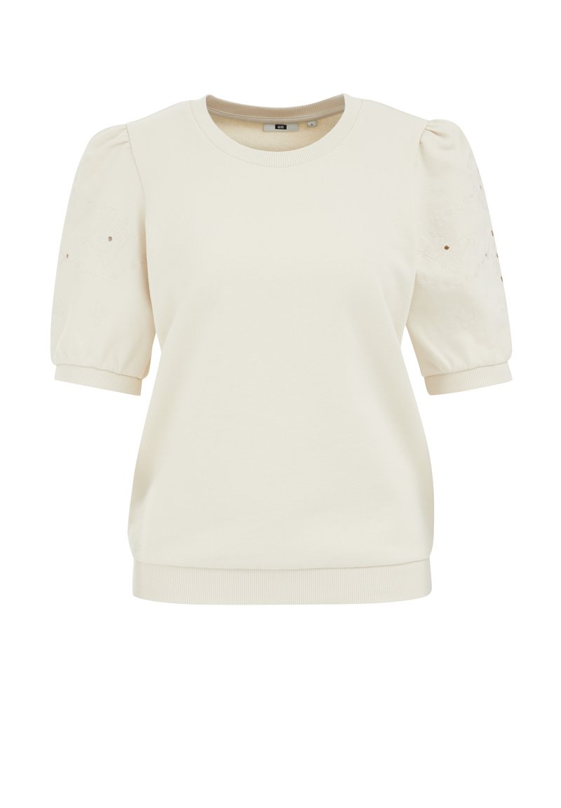 Cremefarbener Sweatshirt mit kurzen Puffärmeln, gerippten Bündchen und Saum, mit dezentem Stickereidetails an den Ärmeln. Weicher, strukturierter Stoff.