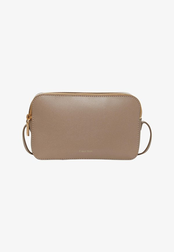 Calvin Klein FOIL LOGO ELONGATED CAMERA - Cross body bag - desert taupe