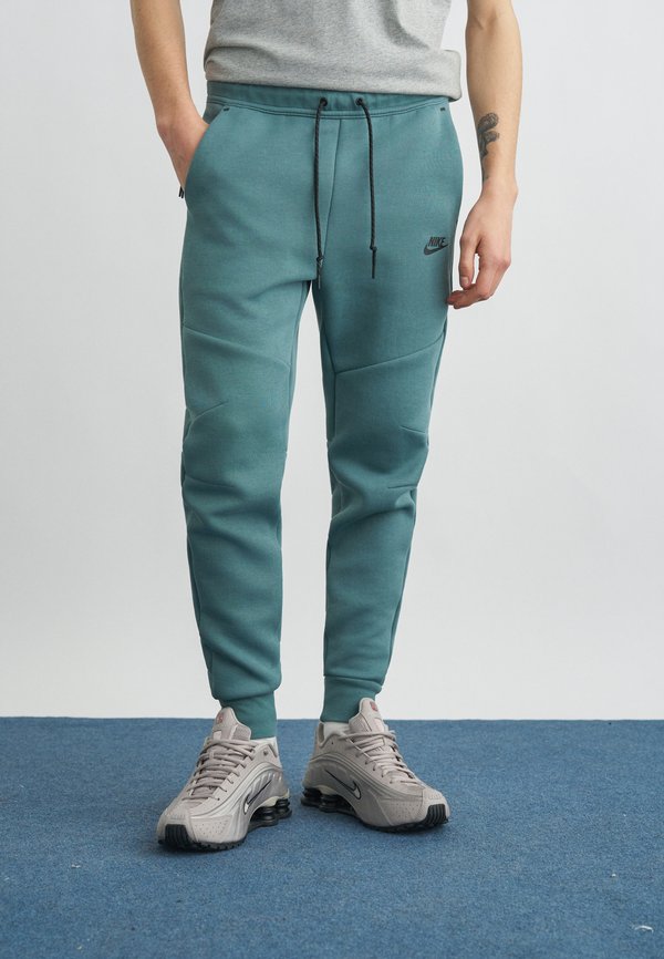 Nike Sportswear Tracksuit bottoms - mineral slate/black
