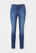 Schmale Jeans aus mittelblauem Denim mit einer mittelhohen Taille, fünf Taschen und Reißverschlussdetails am Knöchel. Glatte Textur und figurbetontes Design.