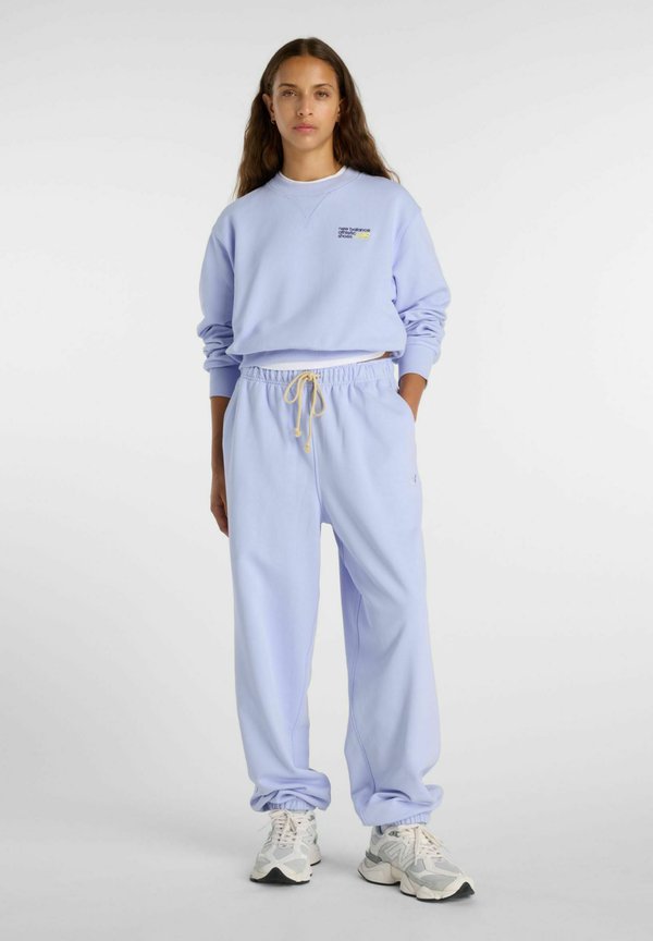New Balance ATHLETICS FRENCH TERRY  - Tracksuit bottoms - day break