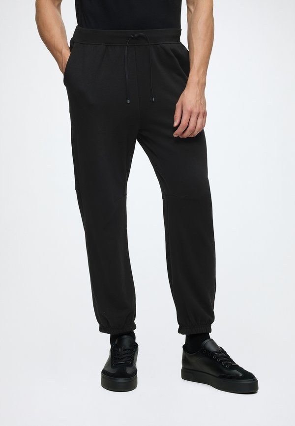 Calvin Klein ICON SPORT - Tracksuit bottoms - black
