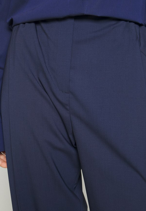 A.W.A.K.E. MODE TAPERED PANTS WITH VERTICAL SLIT KNEES