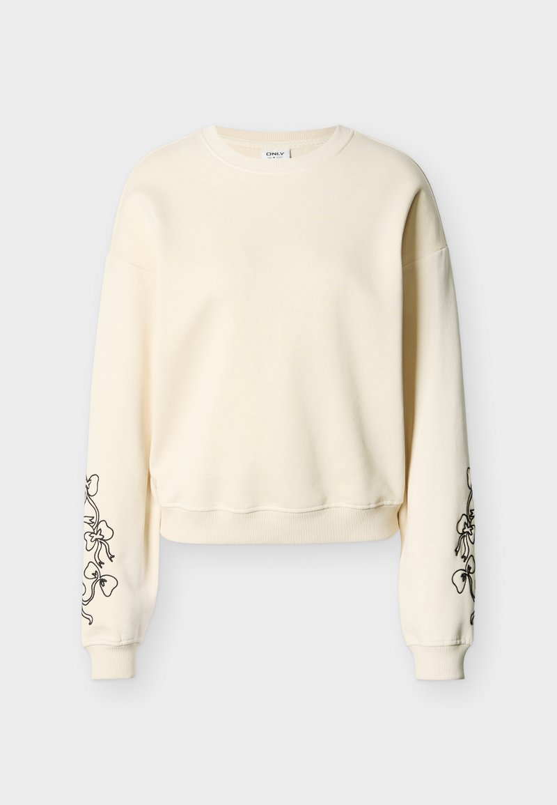 Cremefarbener Pullover mit langen Ärmeln, gerippten Bündchen und Saum, mit schwarzen floralen Linienzeichnungen auf beiden Ärmeln.