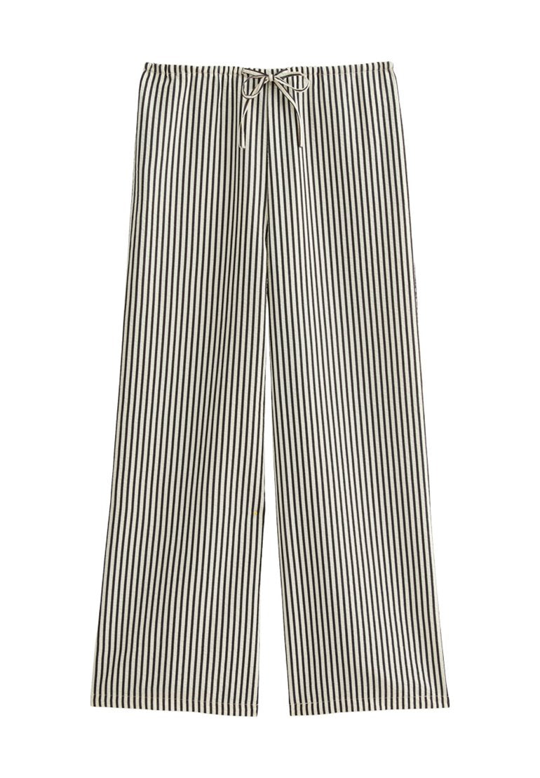 Schwarz-weiß gestreifte weite Hose mit einem Kordelzugbund, aus weichem Stoff gefertigt, mit einem lockeren, entspannenden Schnitt und sauberem Saum.