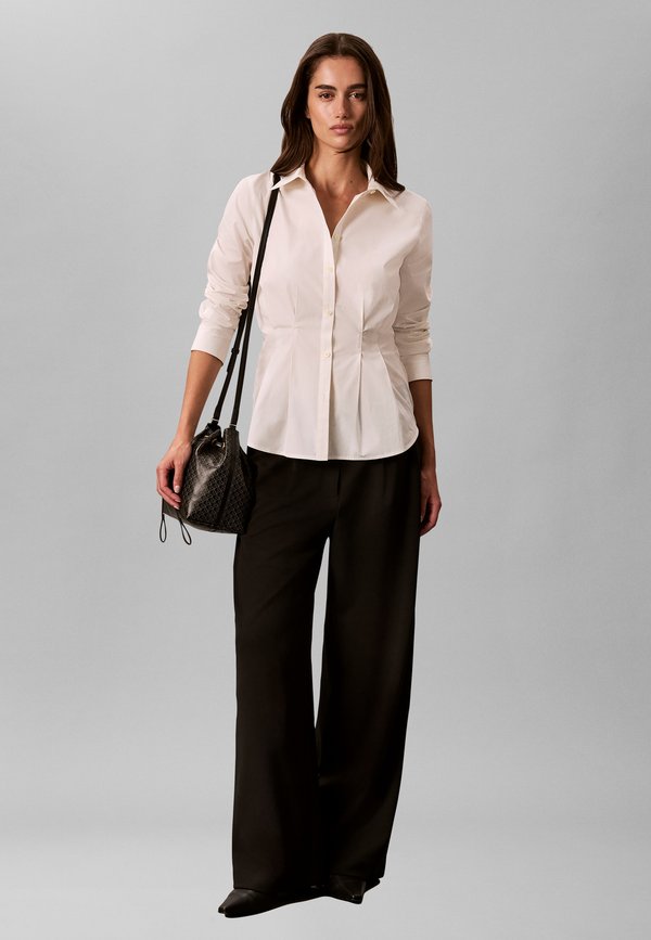 Calvin Klein DRAWSTRING BUCKET - Cross body bag - black