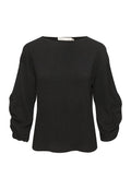 Schwarze Bluse mit rundem Halsausschnitt, lockerer Passform und Puffärmeln. Strukturiertes Gewebe mit einem subtilen Muster. Abgeschnittene Saumlinie.