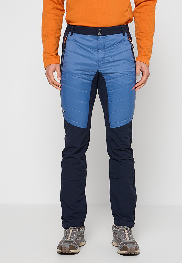 Blaue isolierte Hose mit gepolstertem Vorderteil, dunkelblauen unteren Bereichen, mehreren Taschen mit orangenen Reißverschlüssen und einem taillierten Design für Outdoor-Aktivitäten.