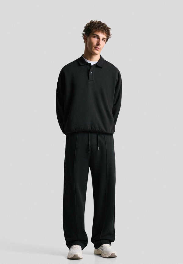 Bershka Tracksuit bottoms - black