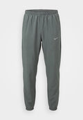 Nike Performance MILER - Tracksuit bottoms - smoke grey