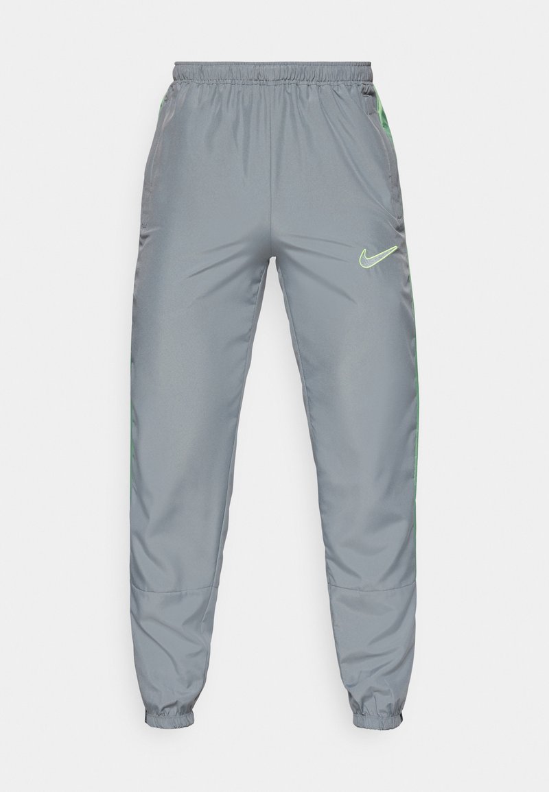 Nike Jogginghose aus grauem Polyester mit elastischem Bund, schmal zulaufenden Bündchen und neongrünen seitlichen Akzenten; verfügt über ein Logo auf der vorderen rechten Seite.