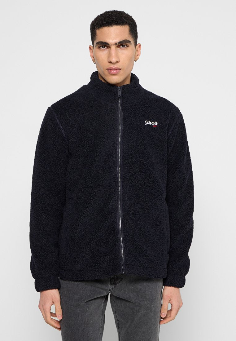 Dunkelblaue Fleecejacke mit hohem Kragen und durchgehendem Reißverschluss. Mit Schott-Logo auf der linken Brust. Weicher, strukturierten Stoff mit lässigerPassform.
