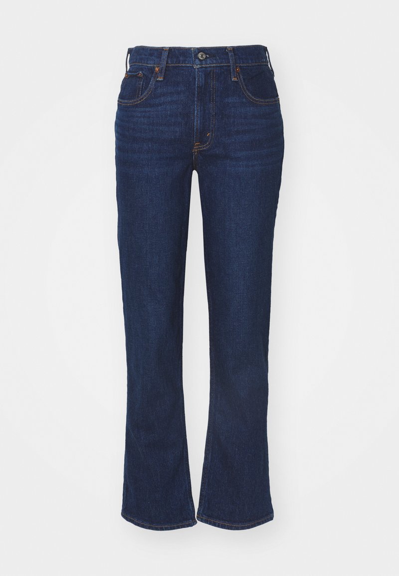 Dunkelblaue Jeans im Schlag mit hohem Bund, fünf Taschen, kontrastierenden Nähten und einem Knopfverschluss. Glatte Textur.