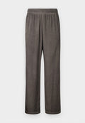 Weit geschnittene, dunkelgraue Wildlederhose mit elastischem Bund und Seitentaschen, flach liegend vor weißem Hintergrund gezeigt.