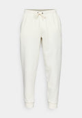 Weiße Sweatpants mit einem verstellbaren Bund, schmal zulaufenden Beinen, Seitentaschen und einem kleinen Logo. Hergestellt aus weichem, glattem Stoff.
