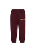 Burgunderfarbene Sweatpants mit elastischem Bund und Zugband, mit einem goldenen "TIMBERLAND"-Logo auf dem Oberschenkel und gerippten Knöcheln.