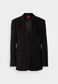 Schwarzer Blazer mit Reverskragen, zwei Vordertaschen, zwei Knöpfen und einem gemusterten Innenfutter. Hergestellt aus glattem Stoff.