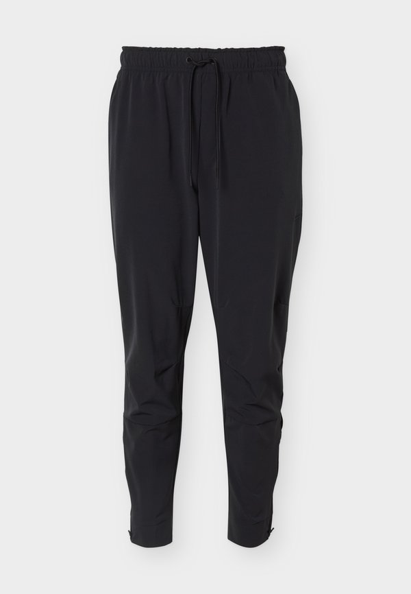Nike Performance UNLIMITED - Tracksuit bottoms - black