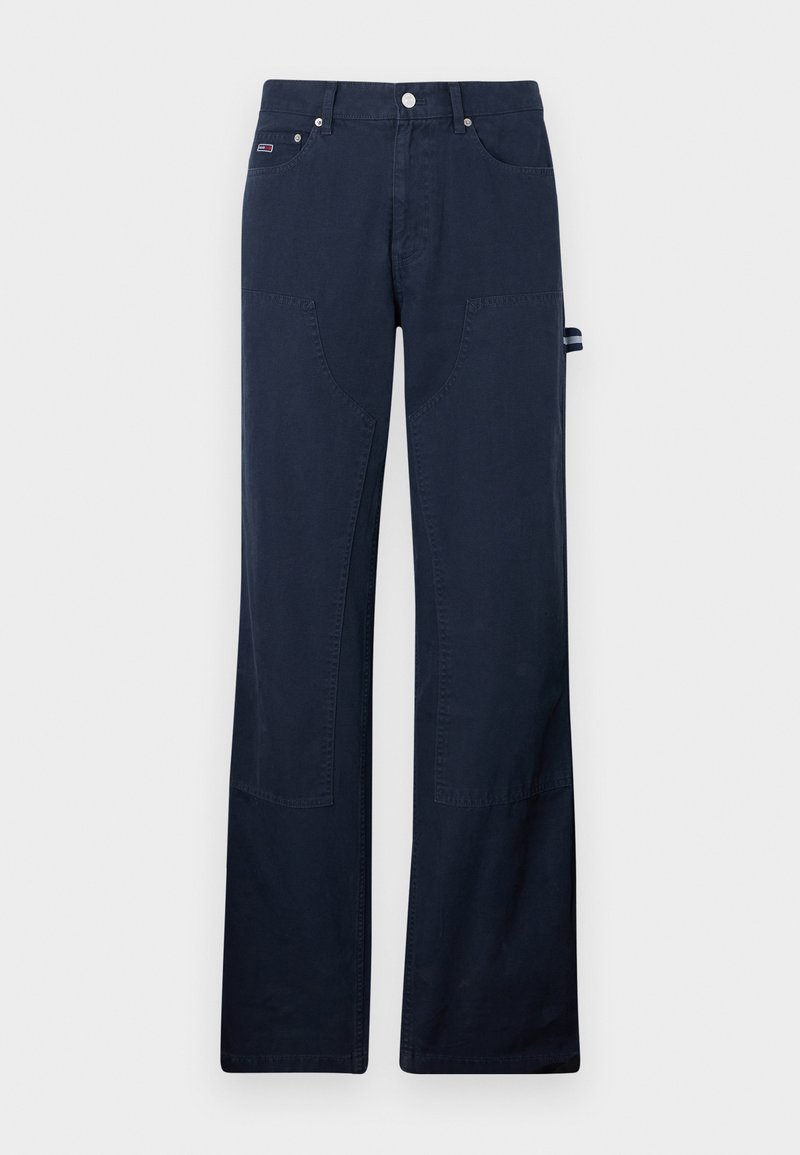 Marineblaue Baumwollhosen mit geraden Beinen, ausgestattet mit Fronttaschen, Nähdetails und einer seitlichen Schlaufe zur Befestigung von Werkzeugen.