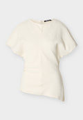 Asymmetrische, kurzärmelige Bluse in Off-White mit strukturierter Stoffqualität und seitlichem Reißverschluss.