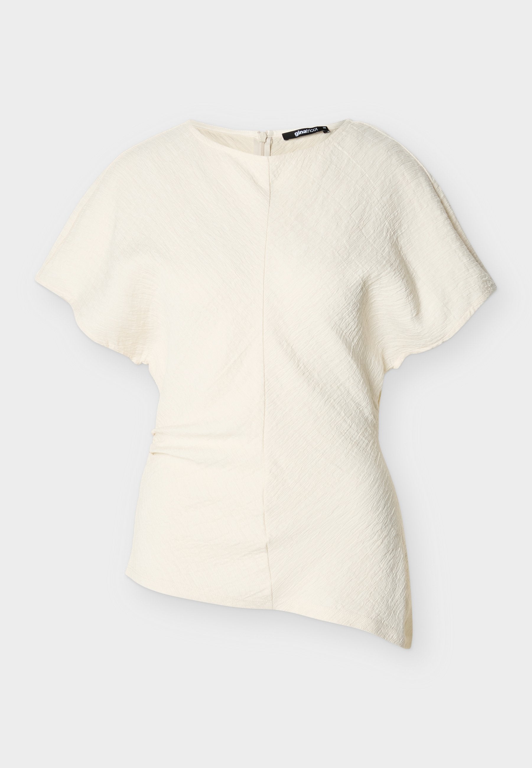 Asymmetrische, kurzärmelige Bluse in Off-White mit strukturierter Stoffqualität und seitlichem Reißverschluss.