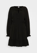 Schwarzes langärmliges Kleid mit gebundenem Ausschnitt, geraffter Taille und volanthen Saum. Glattes, leichtes Material mit fließender Silhouette.