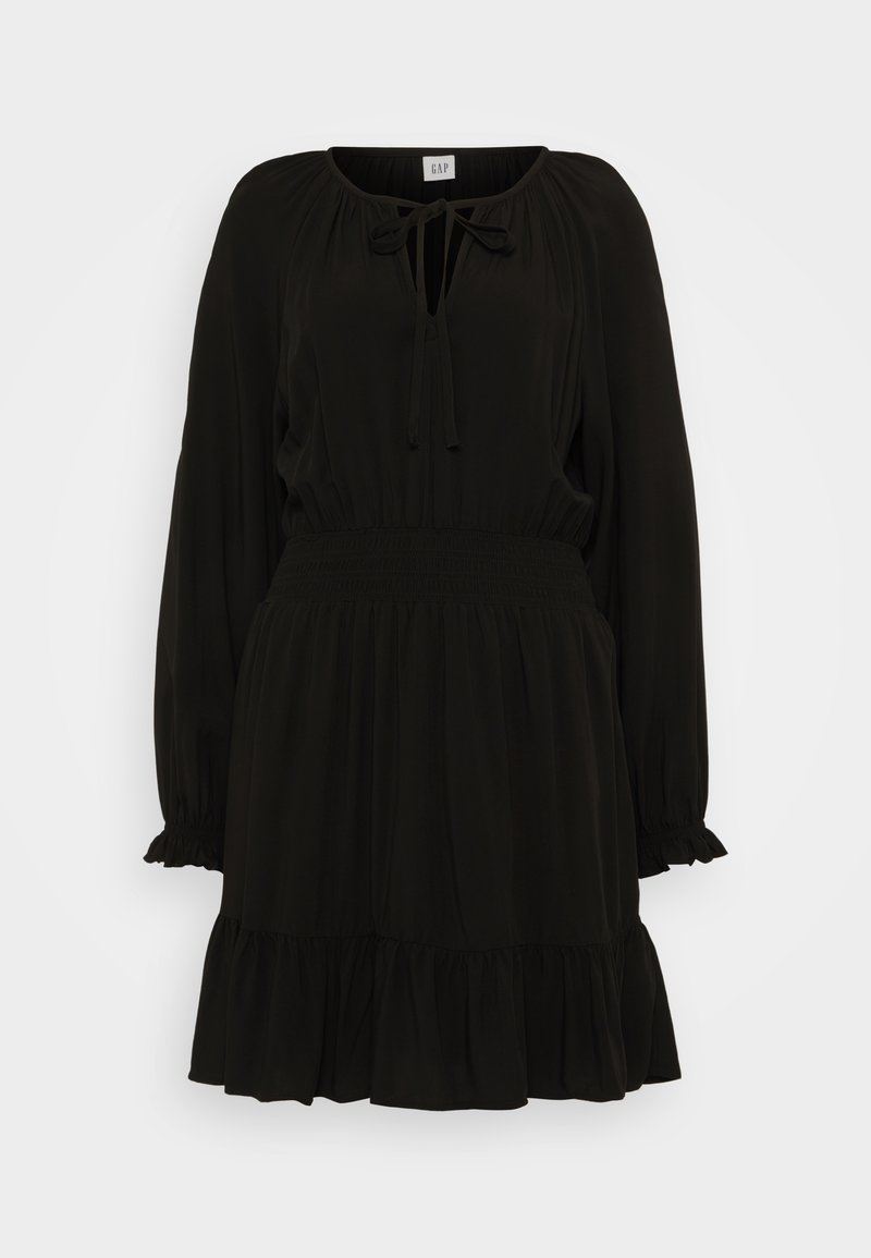 Schwarzes langärmliges Kleid mit gebundenem Ausschnitt, geraffter Taille und volanthen Saum. Glattes, leichtes Material mit fließender Silhouette.