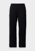 Schwarze Sweatpants aus Baumwolle mit einem elastischen Bund und Kordelzügen, geradem Bein Design und ohne sichtbare Muster oder Akzente.