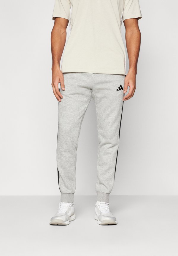 adidas Sportswear REGULAR FIT - Tracksuit bottoms - medium grey heather/black