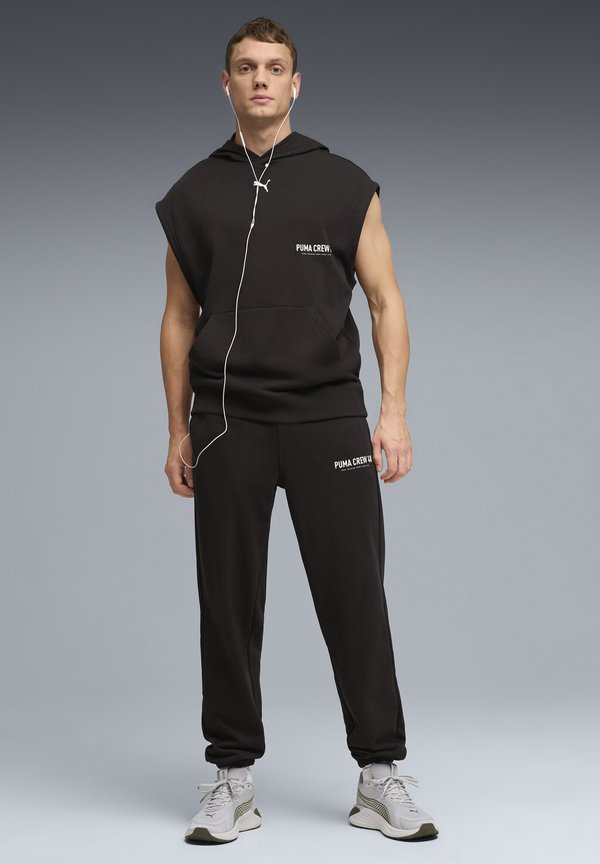 Puma GRAPHICS TRAINING JOGGING - Tracksuit bottoms - black