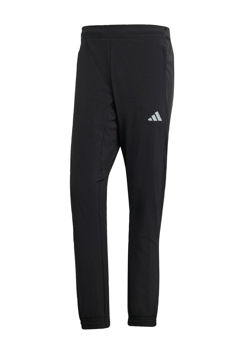 Schwarze Sporthose mit schmalem Schnitt, aus glattem Stoff. Verfügt über seitliche Taschen und ein reflexives Logo auf dem oberen linken Oberschenkel.
