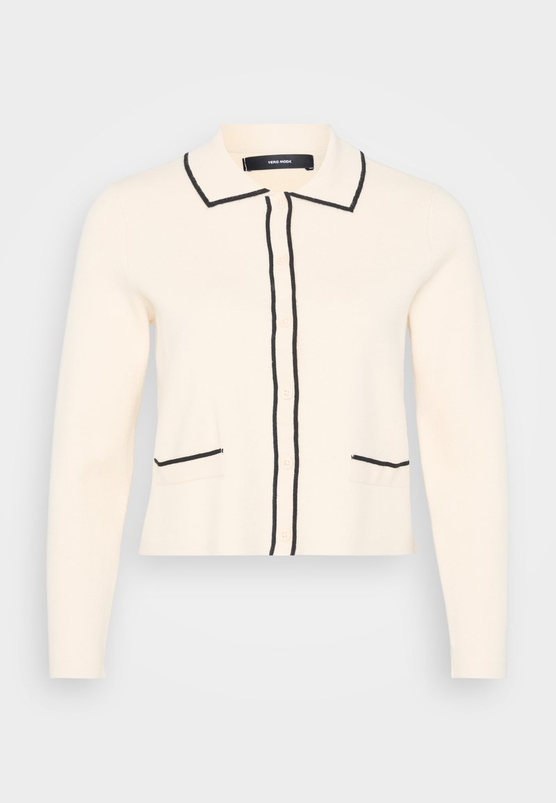 Cremefarbener Cardigan mit schwarzem Besatz, mit Kragen, vorderem Knopfverschluss und zwei unteren Taschen mit schwarzem Detail. Weiche Strickstruktur.
