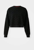 Schwarzer, verkürzter Pullover mit strukturiertem Blumenmuster, gerippten Bündchen und einem Halsausschnitt. Weicher Stoff mit lockerer Passform und langen Ärmeln.