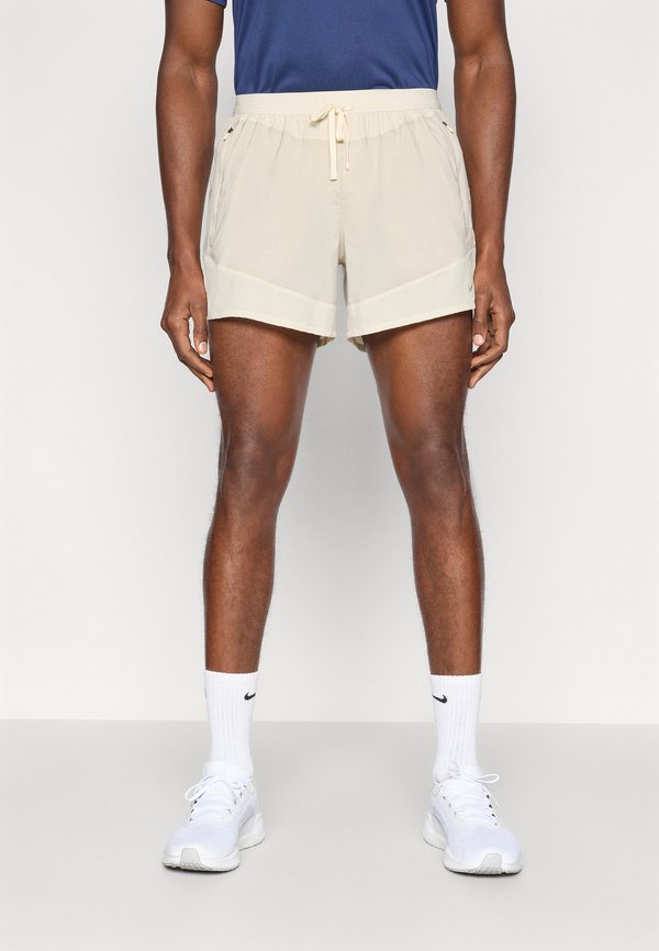 Nike Performance STRIDE SHORT - Sports shorts - cream/birch/natural/reflective silver-coloured