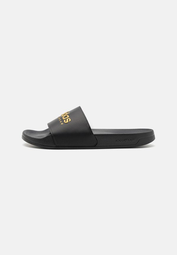 adidas Sportswear ADILETTE SHOWER UNISEX - Pool slides - core black/matte gold-colored