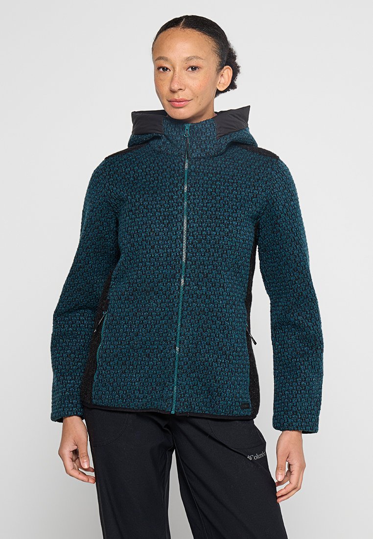Türkisfarbene und schwarze Zip-Jacke mit einem strukturierten Muster, warmem Material, hohem Kragen und zwei seitlichen Taschen. Verfügt über dunkle Schulterakzente.